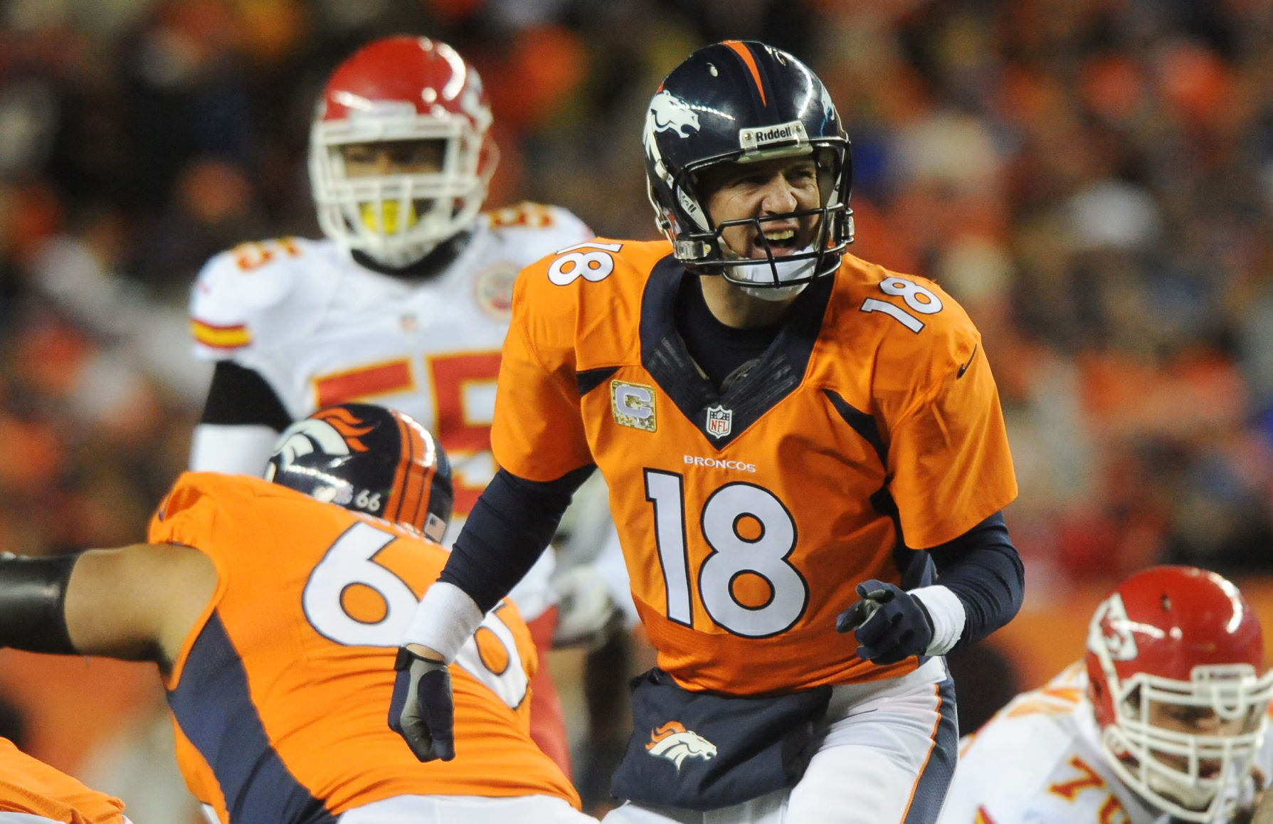 Broncos quarterback Peyton Manning turns around to yell commands to the offense during the second quarter. The Broncos defeated the Chiefs 27-17 at Sports Authority Field at Mile High Stadium on Sunday, November 17, 2013. (The Gazette/Jerilee Bennett)